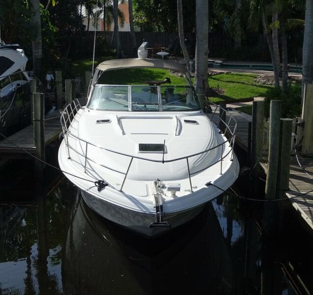 2001 Sea Ray 410 Sundancer docked in a marina.