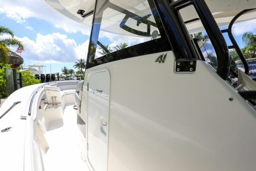 2020 Regulator 41 boat, side view with cockpit and seating area, docked under sunny skies.