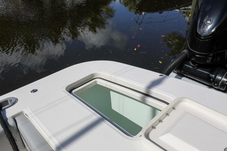 2020 Regulator 41 boat stern with water reflection and engine.