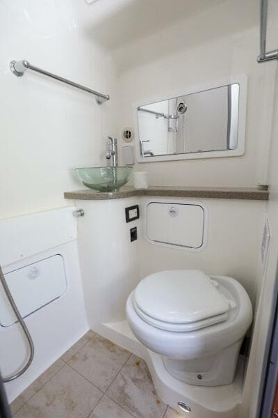2020 Regulator 41 boat bathroom with modern fixtures and glass sink.