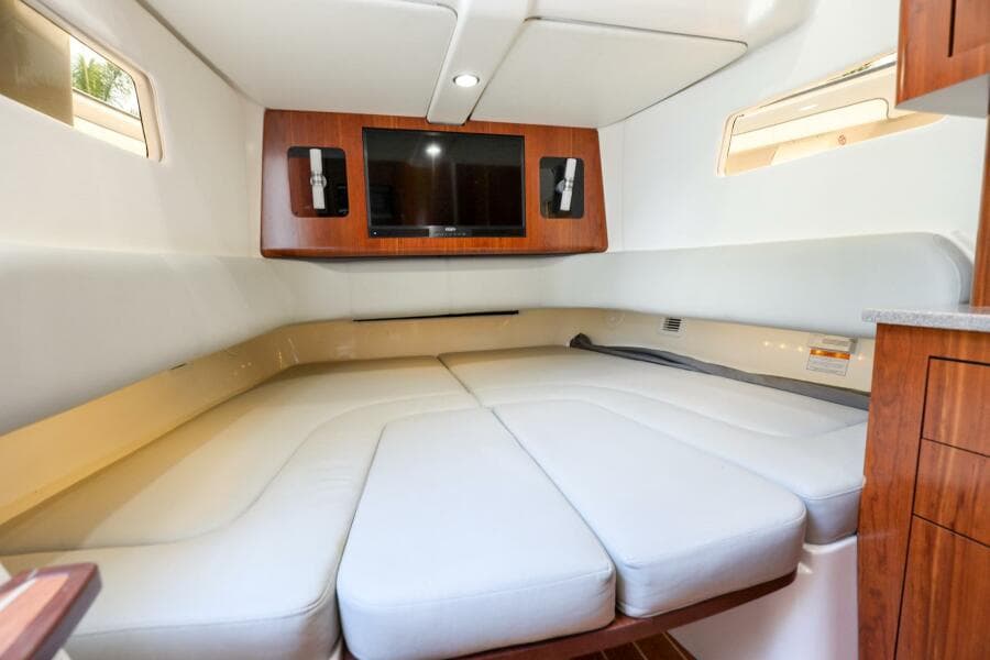 Luxurious cabin interior of 2020 Regulator 41 boat with TV and comfortable seating.