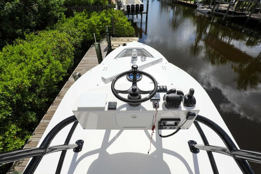 2020 Regulator 41 boat helm station docked by a canal.