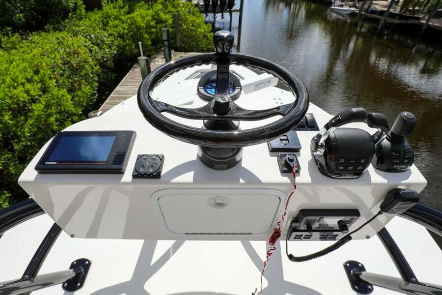 2020 Regulator 41 boat helm with steering wheel, controls, and navigation equipment.
