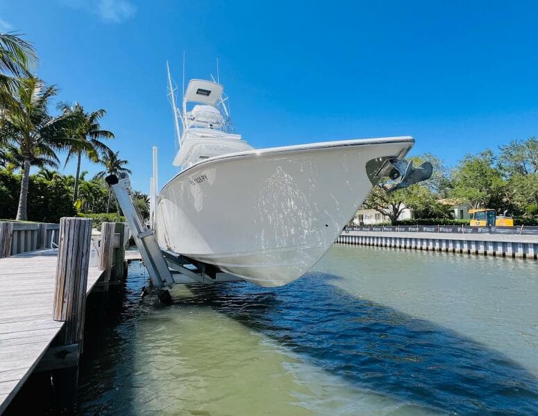 2015 Billfish 39 Custom CC boat docked on a lift in a sunny marina.