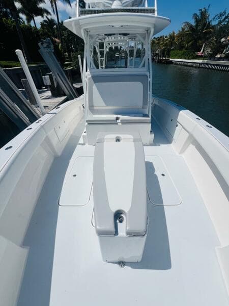 2015 Billfish 39 Custom CC boat, spacious deck, sleek design, docked by the water.