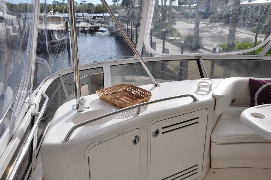 1998 Sea Ray 480 Sedan Bridge yacht interior with marina view.