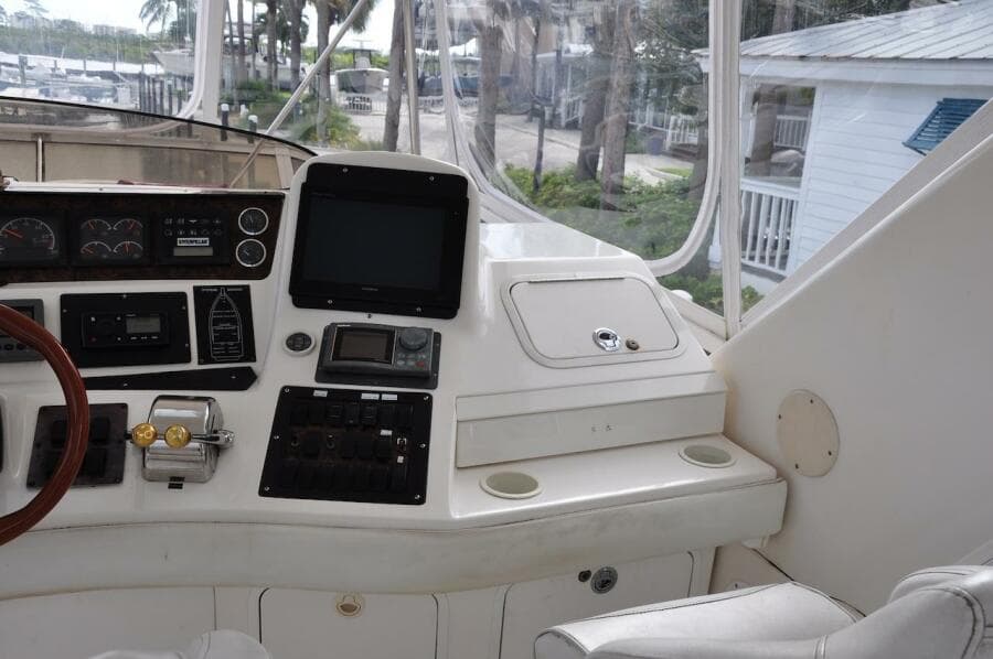 1998 Sea Ray 480 Sedan Bridge helm with navigation equipment and controls.