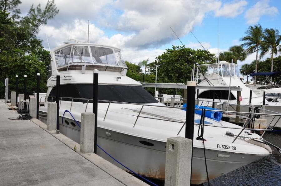 1998 Sea Ray 480 Sedan Bridge yacht docked at marina.