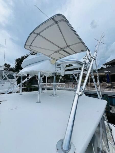 2003 Tiara Yachts 3800 Open with sleek canopy and polished metal supports.