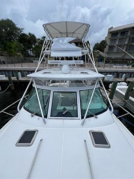 2003 Tiara Yachts 3800 Open docked, showcasing sleek design and spacious deck.
