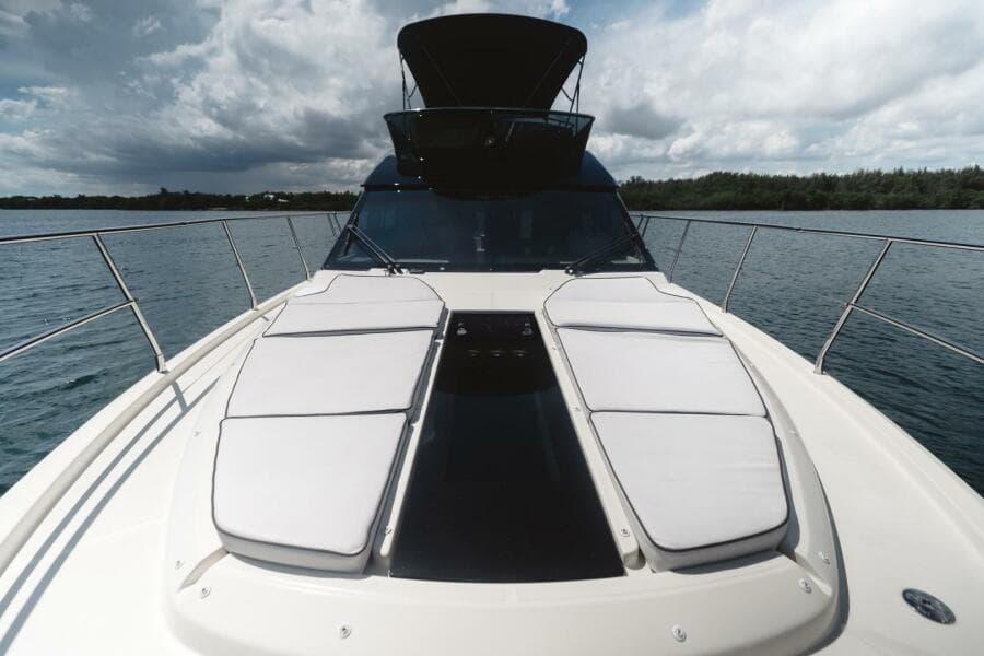 2015 Beneteau Monte Carlo 5 yacht with spacious deck and sleek design on calm waters.