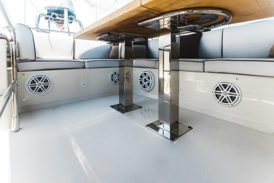 2015 Beneteau Monte Carlo 5 yacht interior with sleek seating and modern table design.