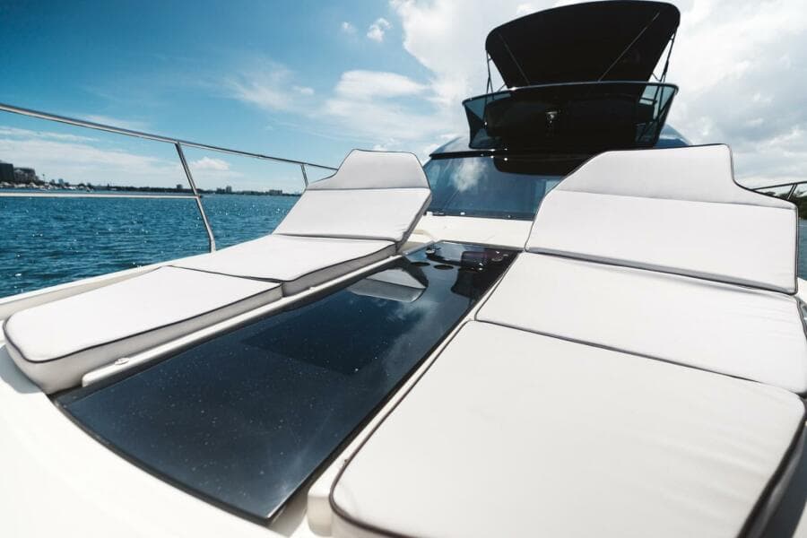 Luxurious 2015 Beneteau Monte Carlo 5 yacht with sun loungers on deck.