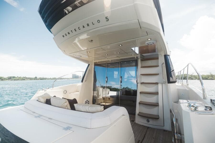 2015 Beneteau Monte Carlo 5 yacht with luxurious deck and seating area.