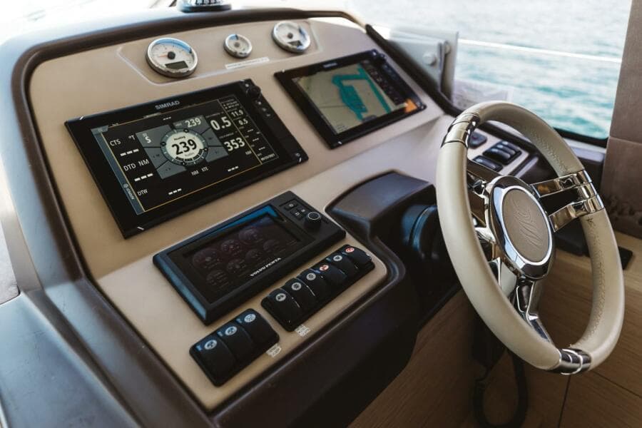 Helm of 2015 Beneteau Monte Carlo 5 with modern navigation displays and controls.