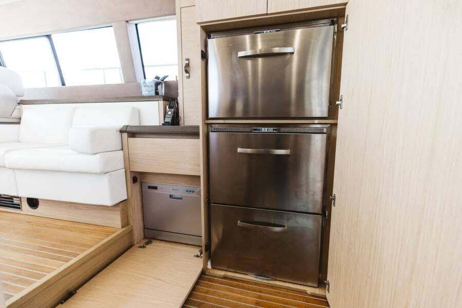 Luxury yacht interior with stainless steel appliances, Beneteau Monte Carlo 5, 2015 model.