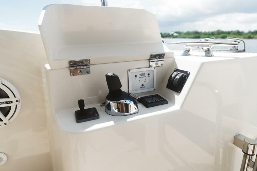 Control panel of 2015 Beneteau Monte Carlo 5 yacht, featuring joystick and navigation controls.