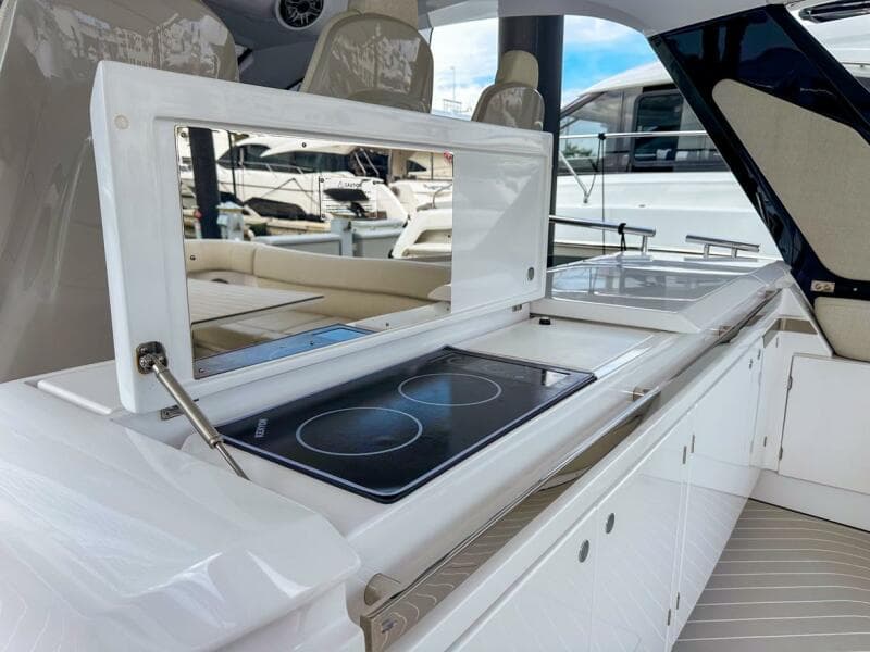 2023 Azimut Verve 47 yacht kitchen with modern stovetop and sleek design.