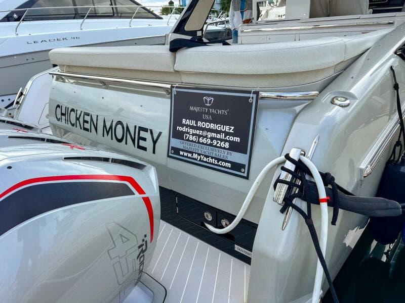 Azimut Verve 47 yacht, 2023 model, named "Chicken Money" with contact details displayed.
