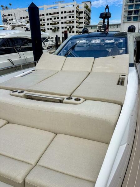 2023 Azimut Verve 47 luxury yacht with spacious sunbathing deck in marina setting.
