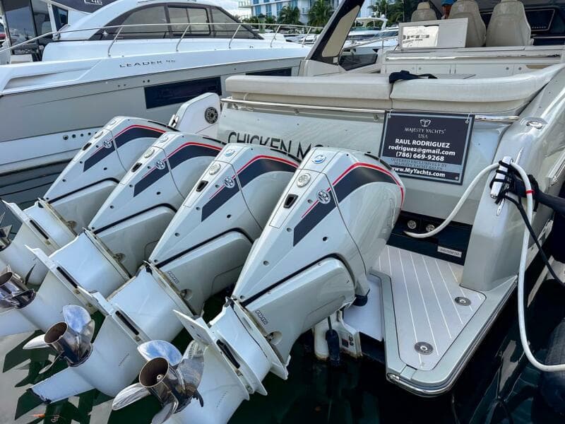 2023 Azimut Verve 47 yacht with triple outboard engines docked at marina.