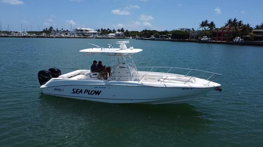 2008 Boston Whaler 320 Outrage boat named Sea Plow on the water.