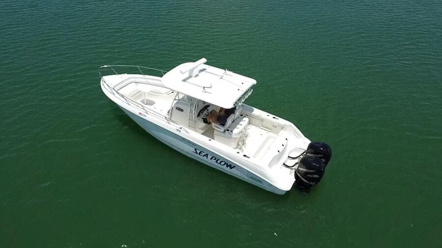 2008 Boston Whaler 320 Outrage boat on calm water.