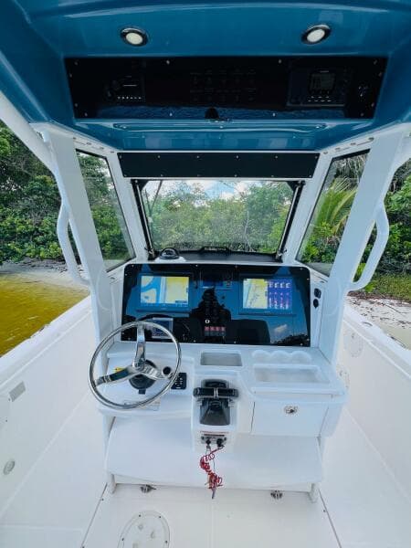 2012 Everglades 295 Center Console boat interior with steering wheel and control panel.