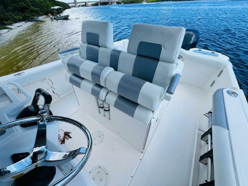 2012 Everglades 295 Center Console boat interior with dual seats and steering wheel.