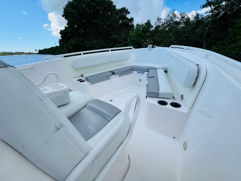 2012 Everglades 295 Center Console boat interior with seating and cup holders.