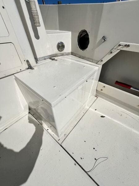 1988 Grady-White 25 SAILFISH boat interior, white seating area, clean and well-maintained.