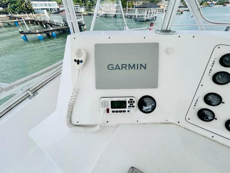 Bertram 54' 1988 yacht helm with Garmin navigation system and radio controls.