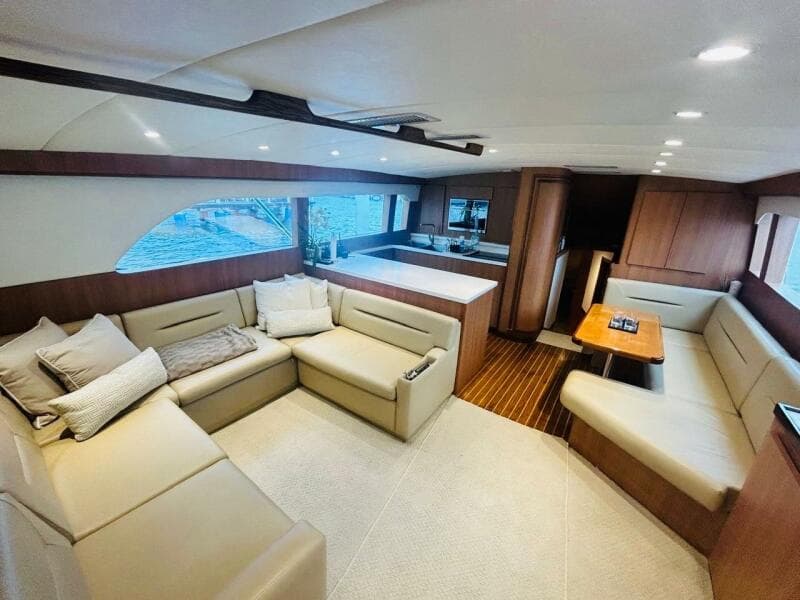 Luxurious interior of 1988 Bertram 54' yacht with spacious seating and modern design.