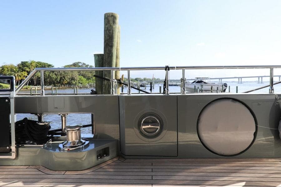 Majesty 120 yacht deck, 2025 model, docked with scenic waterfront view.