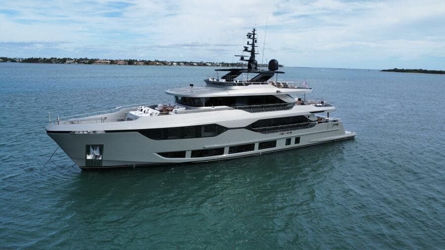 Majesty 120 yacht, 2025 model, cruising on calm blue waters under a clear sky.