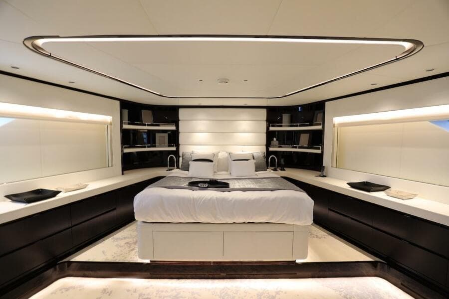 Luxurious bedroom interior on 2025 Majesty 120 yacht, featuring modern design and ambient lighting.