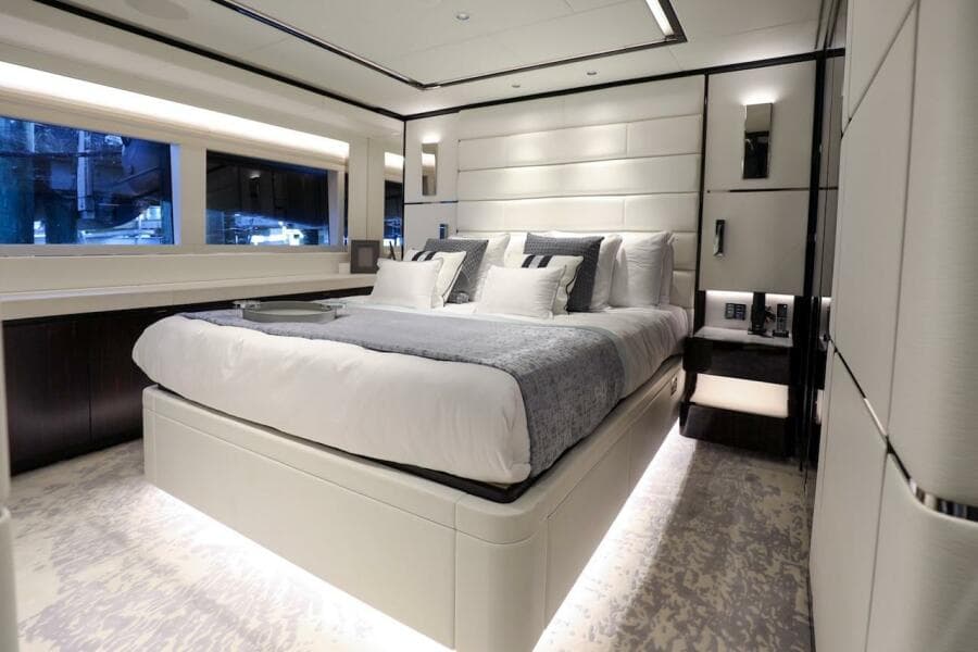 Luxurious bedroom interior of 2025 Majesty 120 yacht, featuring modern design and elegant furnishings.