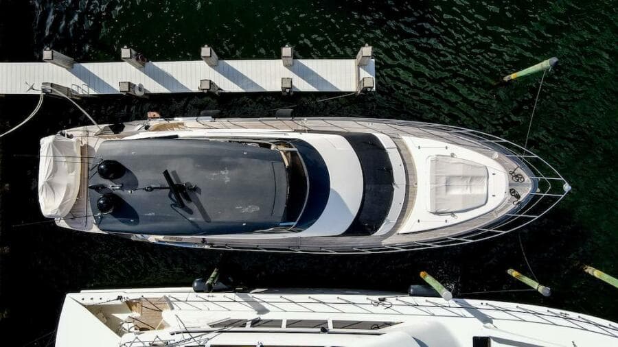 Aerial view of 2016 Marquis 660 Sport Yacht docked at marina.