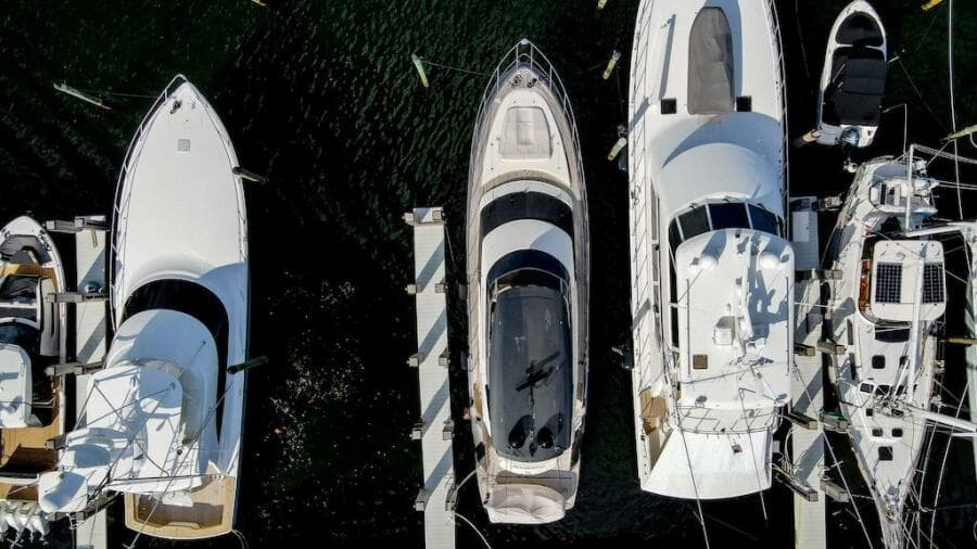 Aerial view of 2016 Marquis 660 Sport Yacht docked among other boats.