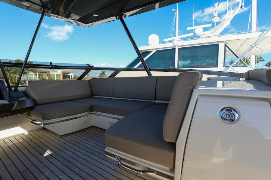 Luxurious 2016 Marquis 660 Sport Yacht with spacious deck seating and sleek design.