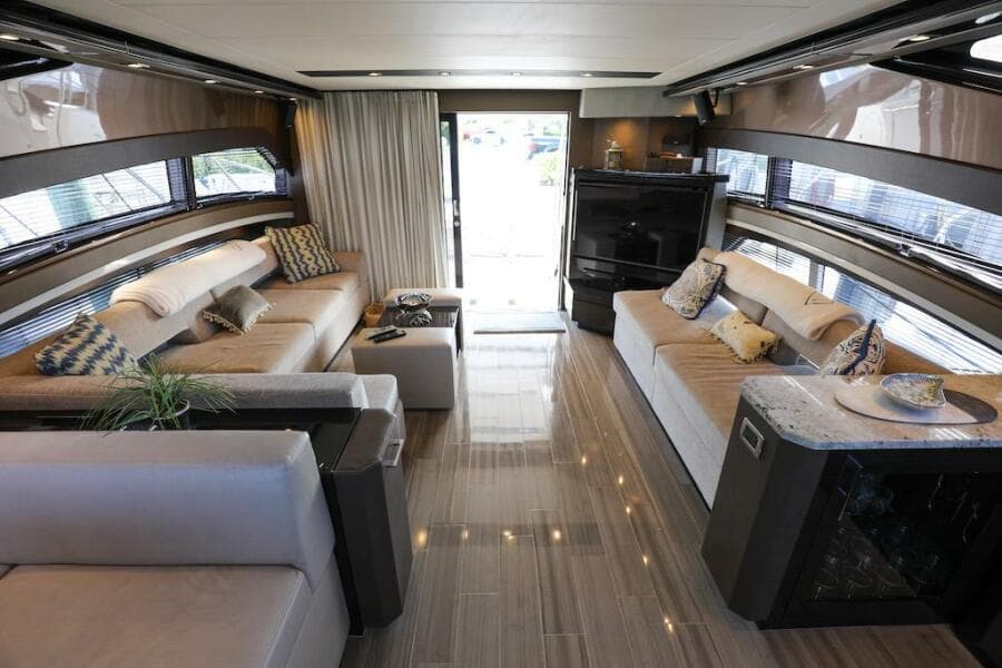 Luxurious interior of a 2016 Marquis 660 Sport Yacht with elegant seating and modern decor.