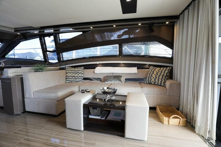 Luxurious interior of 2016 Marquis 660 Sport Yacht with modern seating and decor.