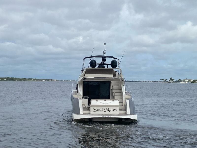 2017 Marquis 500 Sport Yacht Soul Mates cruising on a cloudy day.