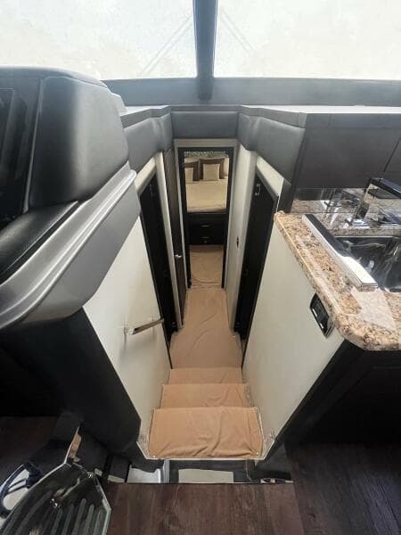 2017 Marquis 500 Sport Yacht interior with stairs and modern design.