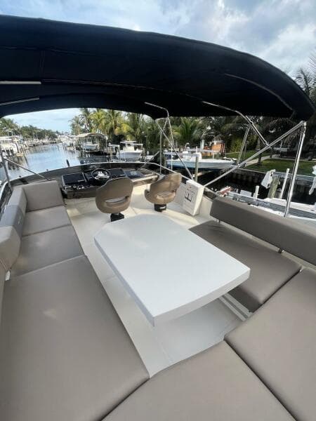 2017 Marquis 500 Sport Yacht with spacious seating and table on deck.