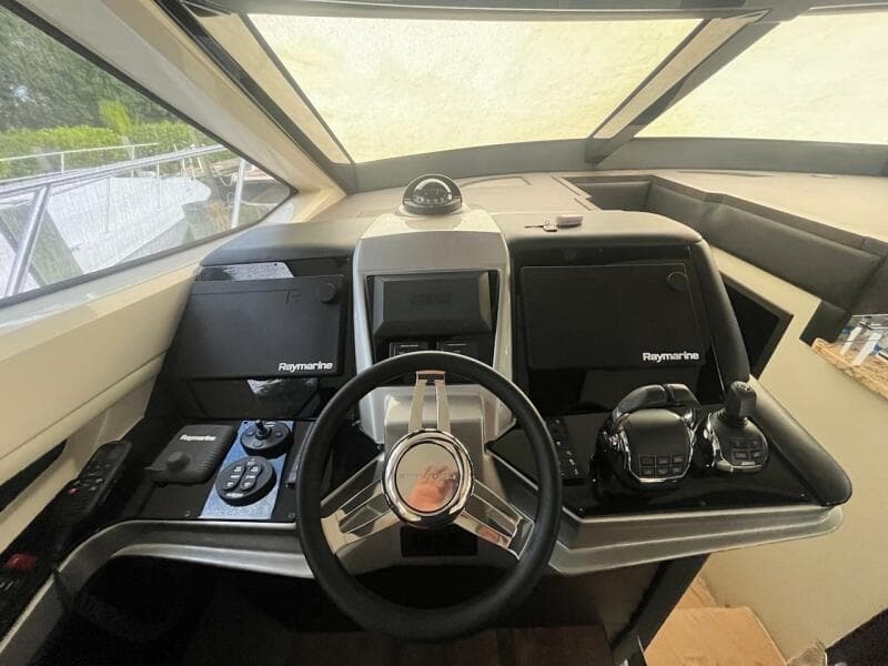 Helm of 2017 Marquis 500 Sport Yacht with Raymarine electronics.