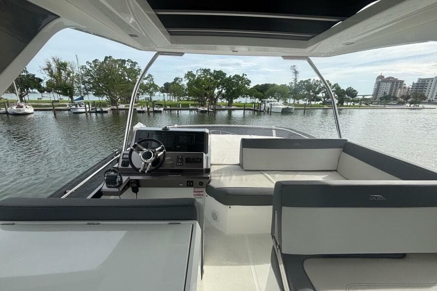 Interior view of 2020 Galeon 500 Fly yacht with helm and seating area.