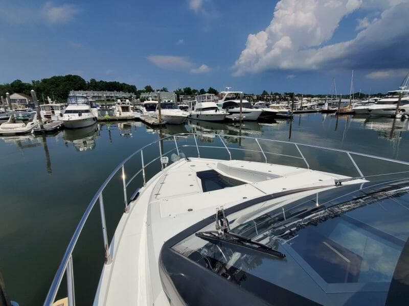 Galeon 500 Fly 2020 yacht docked at a marina with other boats.