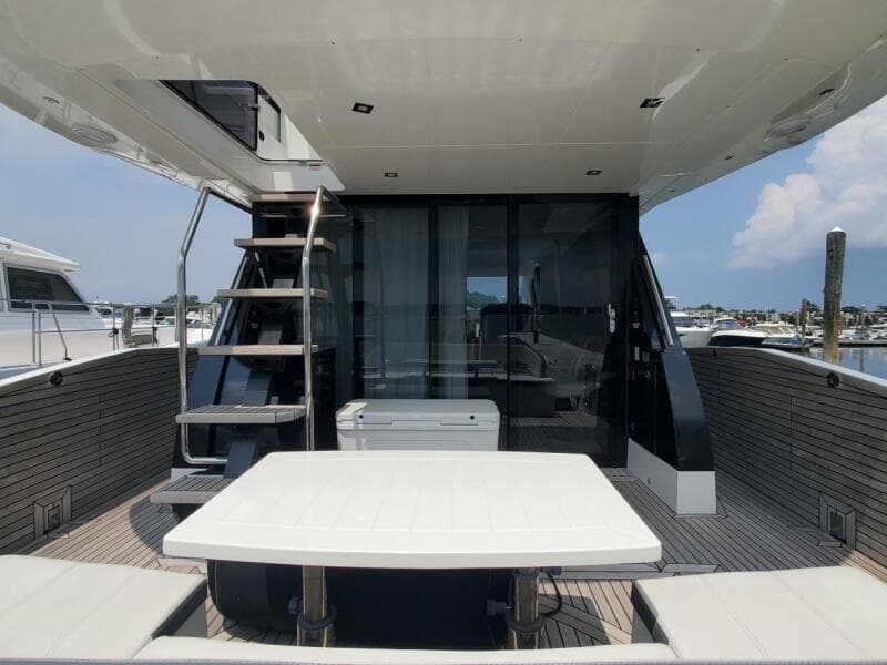 Galeon 500 Fly 2020 yacht with outdoor seating and staircase to upper deck.
