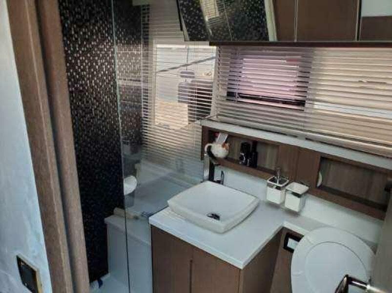 Modern bathroom in 2020 Galeon 500 Fly yacht with sleek design and amenities.